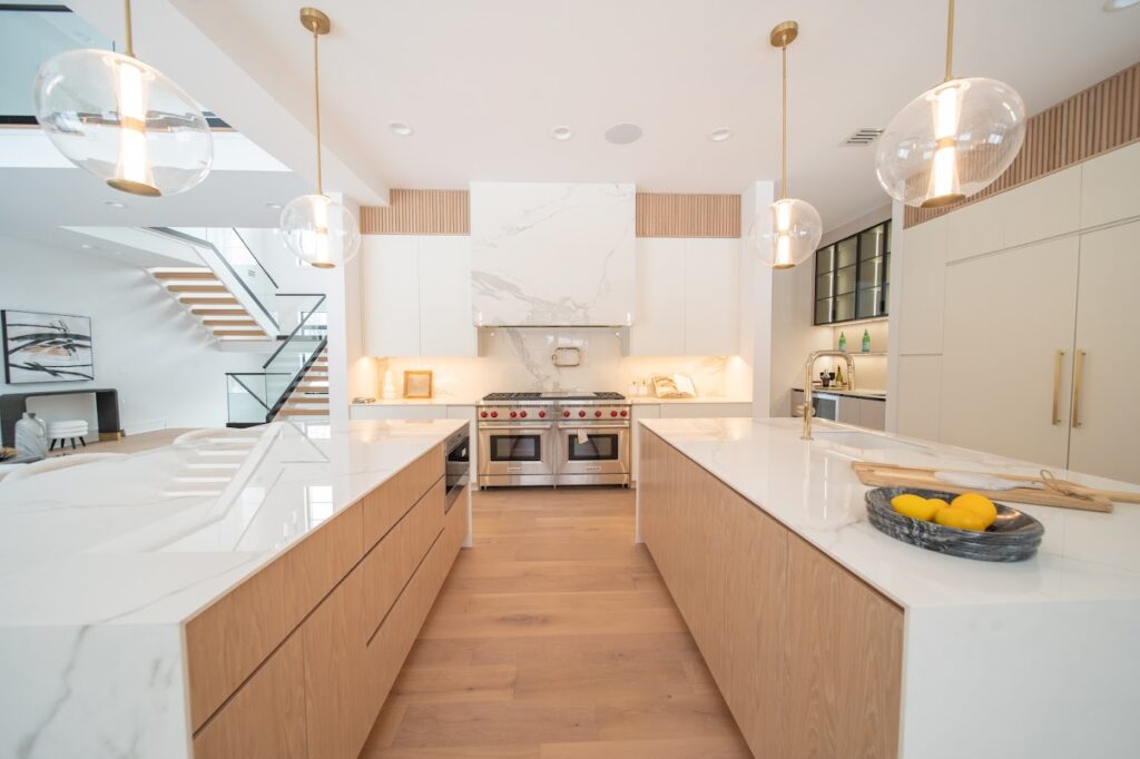 Modern luxury kitchen project by Americana Studio featuring custom cabinetry, double island layout, clean lines, and American-made craftsmanship