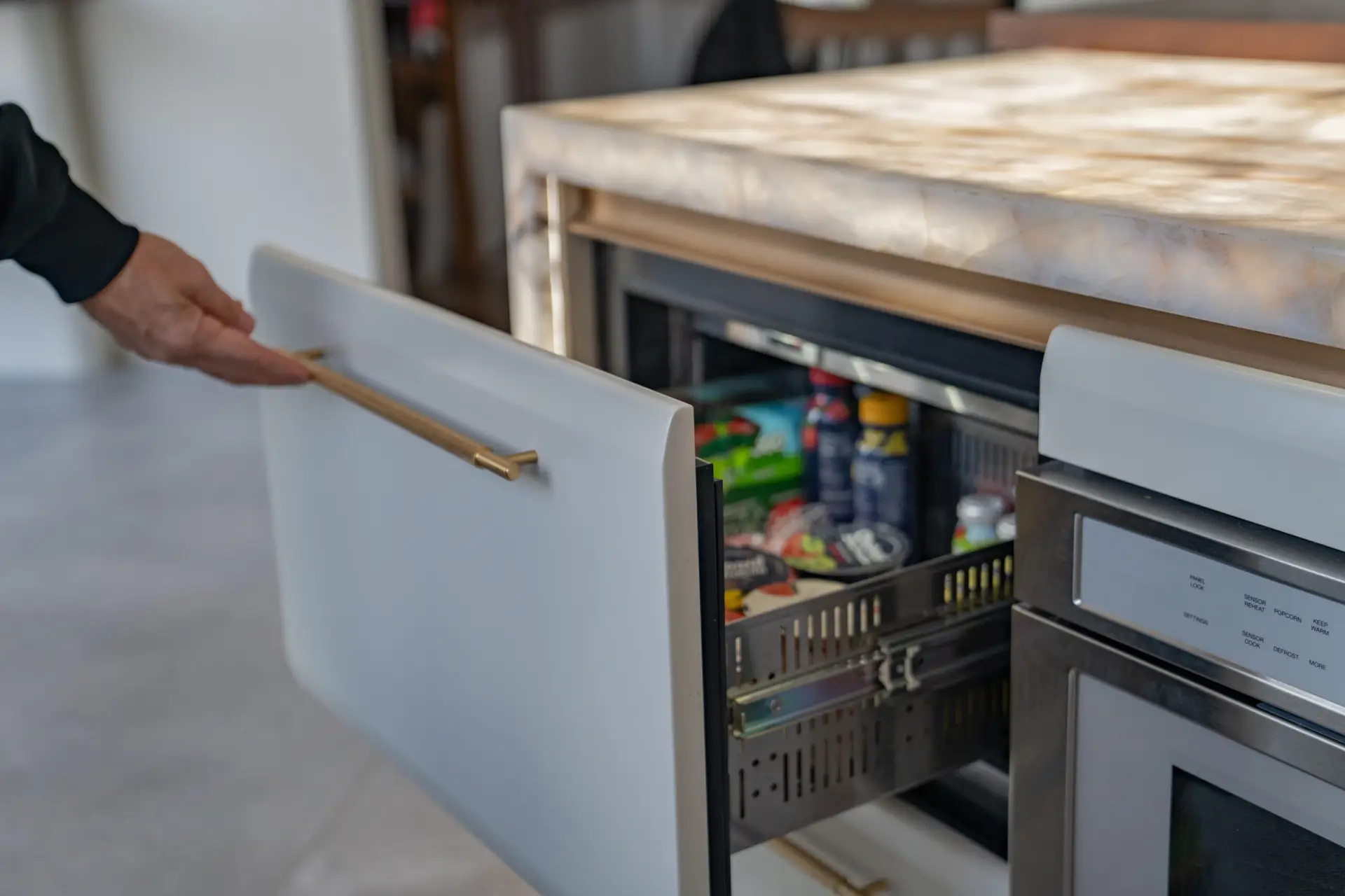 Custom base cabinet drawers in a modern luxury kitchen with clean minimalist lines