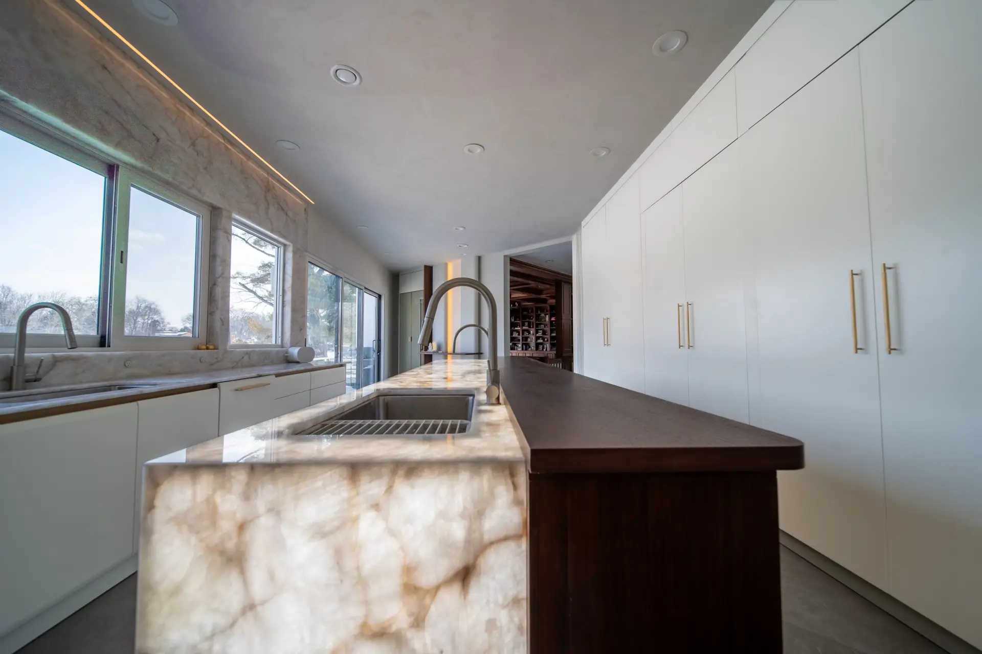 Statement kitchen island in a modern luxury kitchen with custom cabinetry and premium stone surfaces